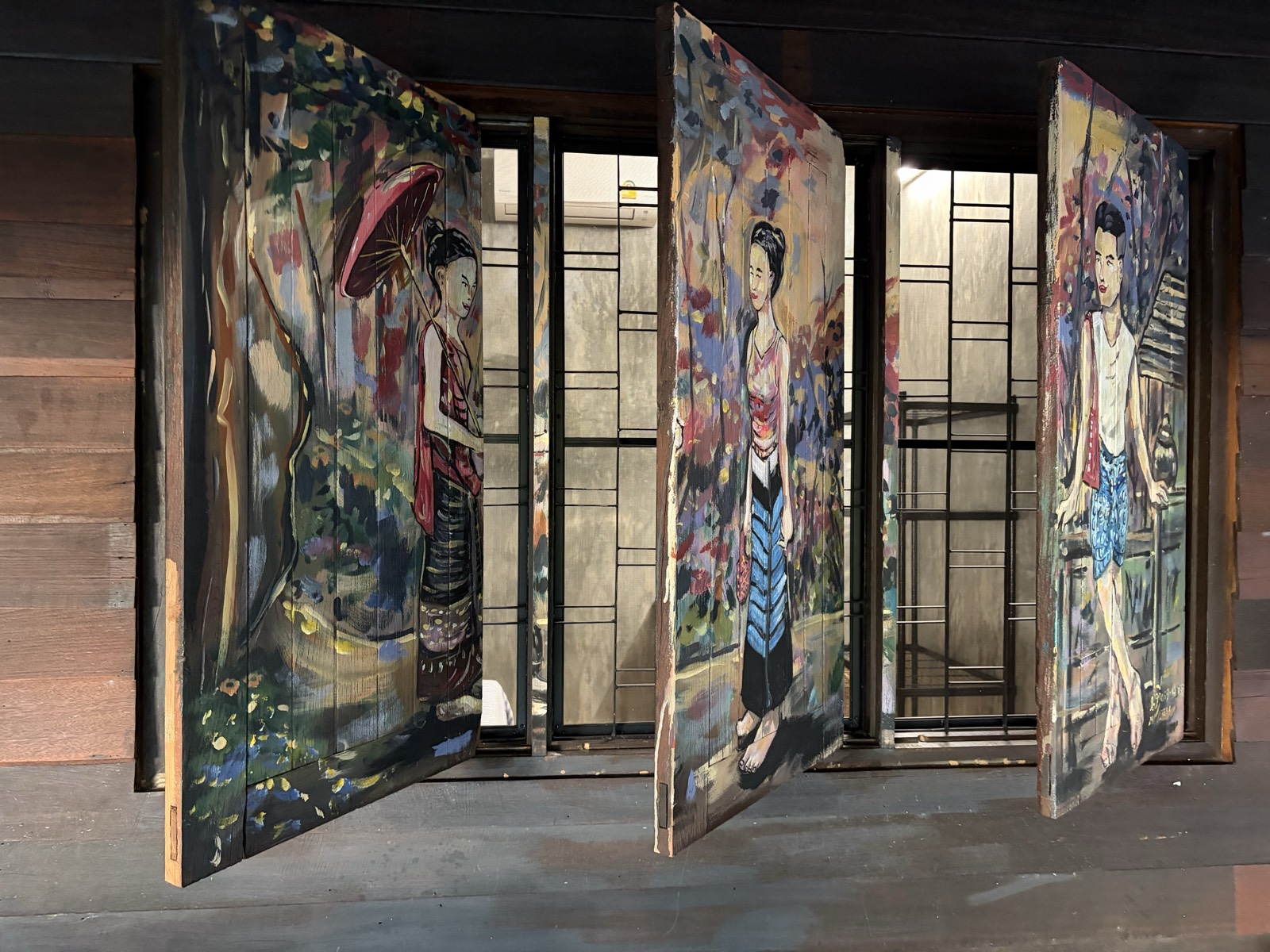 Ueang Kham painted window shutters open